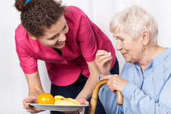 two elderly having meals together